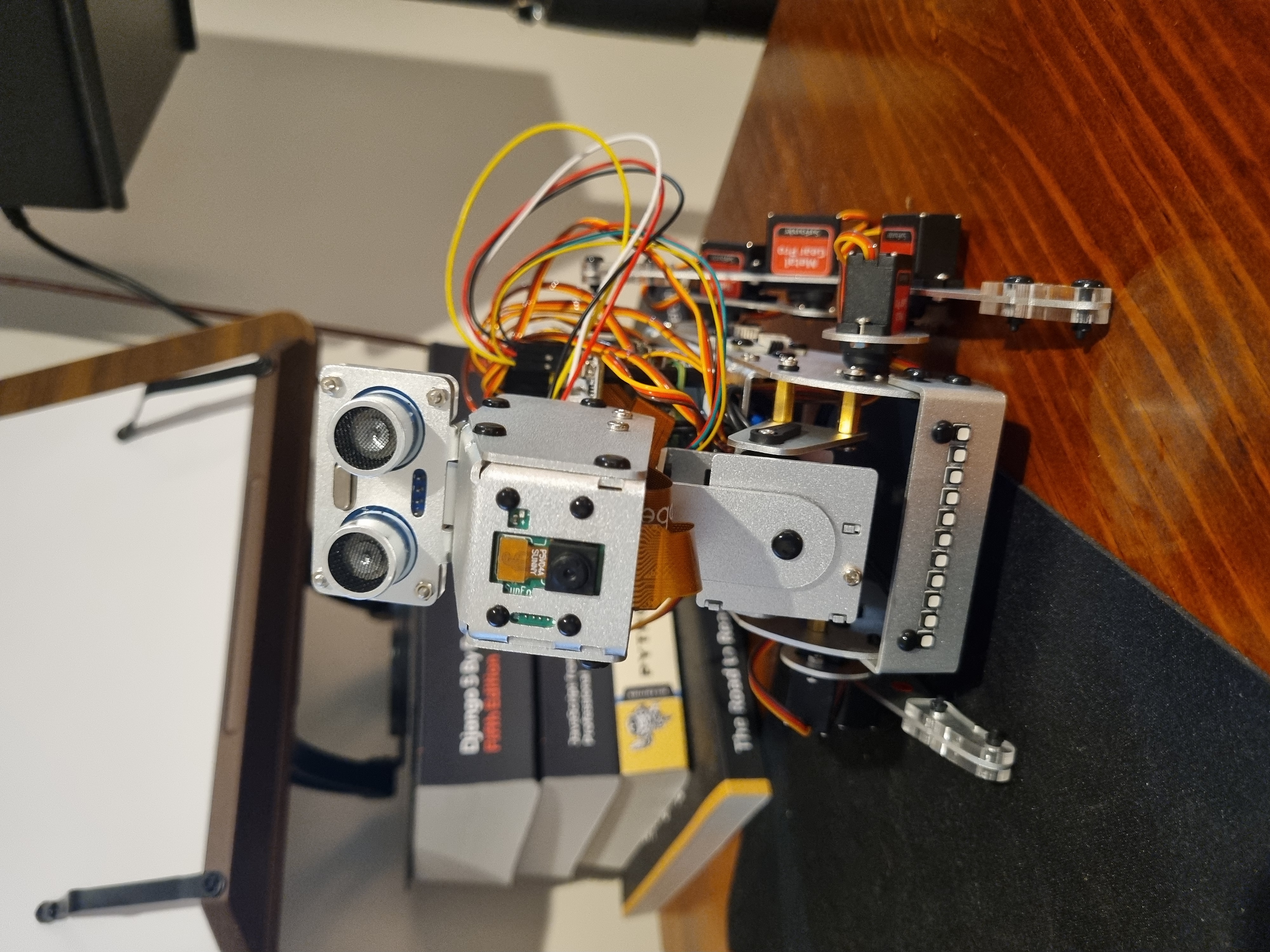A personal robotics prototype with exposed wiring and sensors
